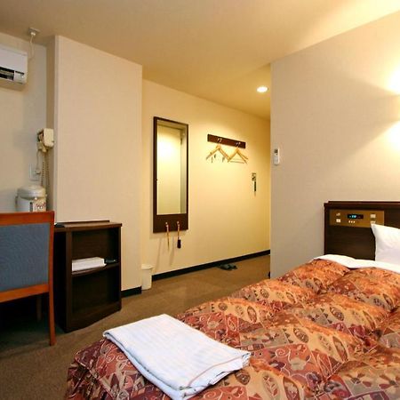 Urban Hotel Kokubu Кірісіма Номер фото
